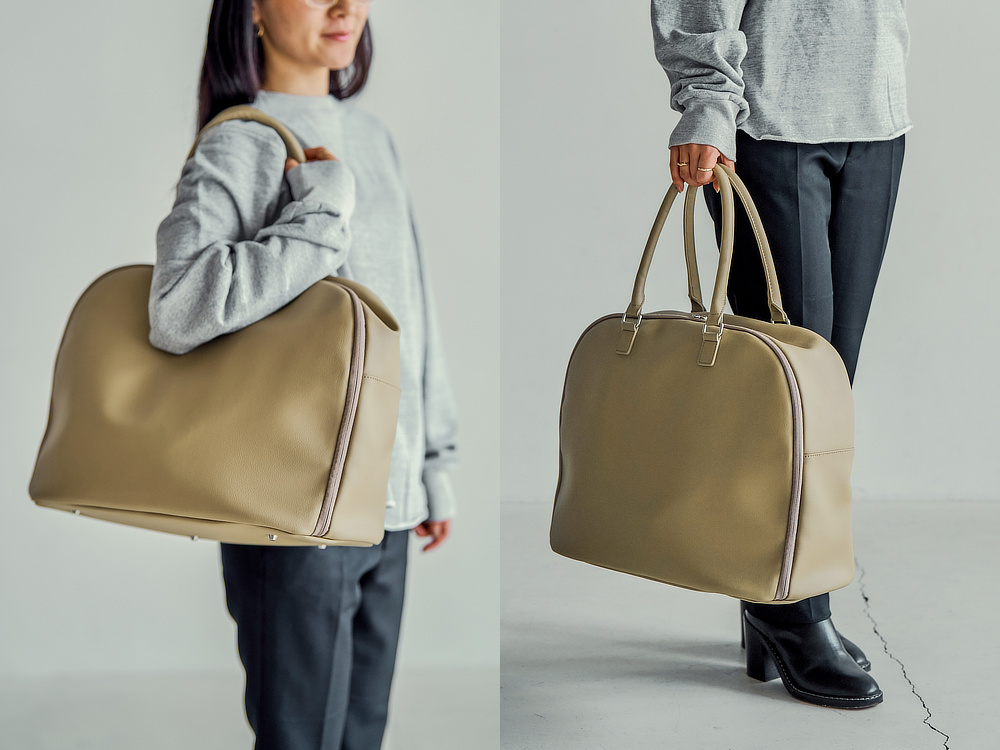 少し長めに設計されたハンドルだから、手持ちや肘掛けはもちろん、肩掛けでも快適に持ち運べます｜1泊2日、2泊3日対応。ガバッと開いて、小旅行や出張の荷物をたっぷり収納！サボテンから生まれたビーガンレザー使用の「旅バッグ」ボストンバッグ|旅フリークがつくるトラベルブランド『Aww（アウ）』